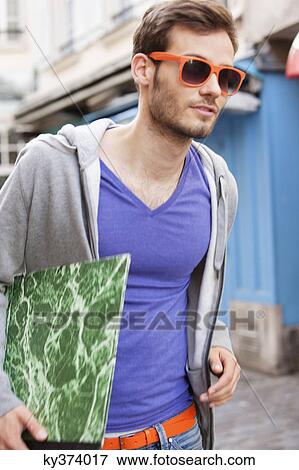 Man carrying a file, Paris, Ile-de-France, France View Large Photo Image Stock Photo - Man carrying a file, Paris, Ile-de-France, France. Fotosearch