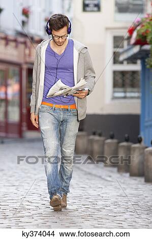 Man reading a newspaper on the street, Paris, Ile-de-France, France View Large Photo Image Picture - Man reading a newspaper on the street, Paris, Ile-de-France, France. Fotosearch