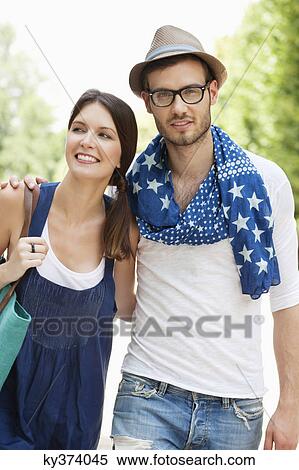 Man walking with his arm around a woman, Paris, Ile-de-France, France View Large Photo Image Stock Photography - Man walking with his arm around a woman, Paris, Ile-de-France, France. Fotosearch