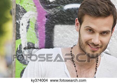 Picture - Portrait of a man smiling, Paris, Ile-de-France, France. Fotosearch