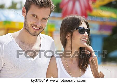 Close-up of a couple smiling together, Paris, Ile-de-France, France View Large Photo Image Stock Photo - Close-up of a couple smiling together, Paris, Ile-de-France, France. Fotosearch
