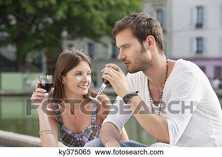 Couple drinking red wine, Paris, Ile-de-France, France View Large Photo Image Stock Photography - Couple drinking red wine, Paris, Ile-de-France, France. Fotosearch