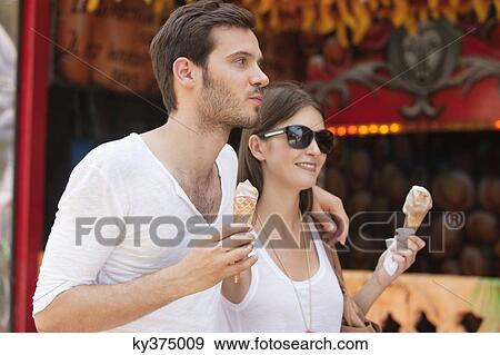 Couple eating ice creams, Paris, Ile-de-France, France View Large Photo Image Stock Photo - Couple eating ice creams, Paris, Ile-de-France, France. Fotosearch