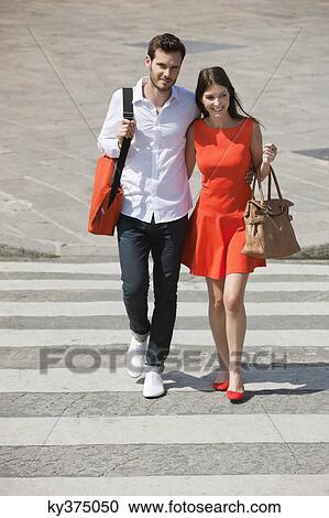 Couple on a crosswalk, Paris, Ile-de-France, France View Large Photo Image Stock Image - Couple on a crosswalk, Paris, Ile-de-France, France. Fotosearch