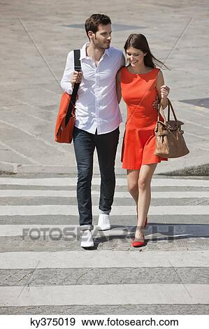 Stock Photo - Couple on a crosswalk, Paris, Ile-de-France, France. Fotosearch