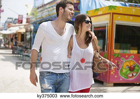 Couple walking in amusement park, Jardin des Tuileries, Paris, Ile-de-France, France View Large Photo Image Stock Image - Couple walking in amusement park, Jardin des Tuileries, Paris, Ile-de-France, France. Fotosearch