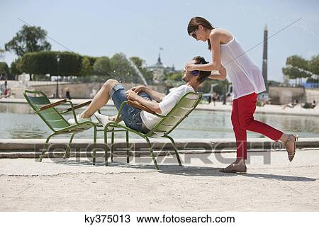 Woman covering eyes of a man with her hands, Bassin octogonal, Jardin des Tuileries, Paris, Ile-de-France, France View Large Photo Image Stock Image - Woman covering eyes of a man with her hands, Bassin octogonal, Jardin des Tuileries, Paris, Ile-de-France, France. Fotosearch