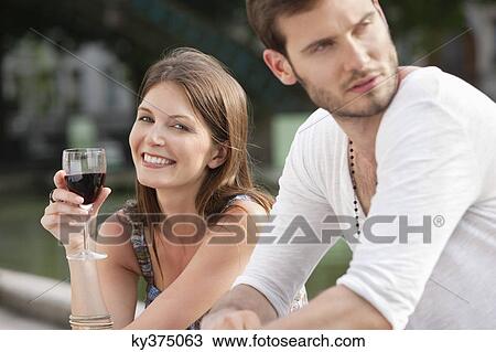 Woman drinking red wine and smiling, Paris, Ile-de-France, France View Large Photo Image Stock Image - Woman drinking red wine and smiling, Paris, Ile-de-France, France. Fotosearch