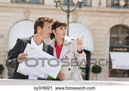 Couple reading a map, Paris, Ile-de-France, France View Large Photo Image Stock Image - Couple reading a map, Paris, Ile-de-France, France. Fotosearch
