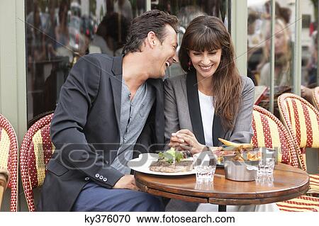 Romantic couple at a restaurant, Paris, Ile-de-France, France View Large Photo Image Stock Image - Romantic couple at a restaurant, Paris, Ile-de-France, France. Fotosearch