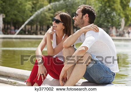 Couple sitting in a garden, Bassin octogonal, Jardin des Tuileries, Paris, Ile-de-France, France View Large Photo Image Stock Image - Couple sitting in a garden, Bassin octogonal, Jardin des Tuileries, Paris, Ile-de-France, France. Fotosearch