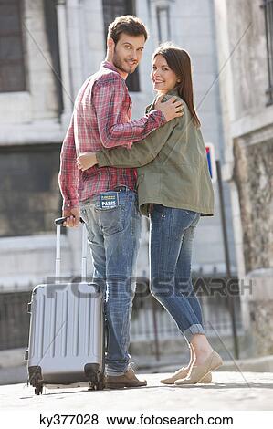 Couple walking on a road with a suitcase, Paris, Ile-de-France, France View Large Photo Image Stock Photo - Couple walking on a road with a suitcase, Paris, Ile-de-France, France. Fotosearch