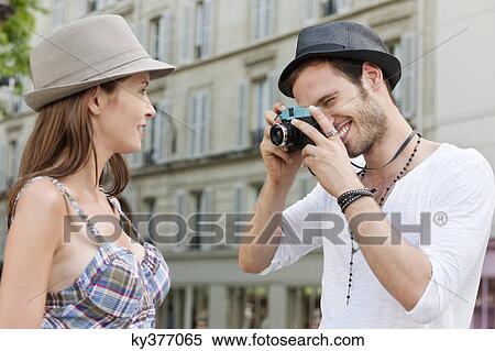 Man taking a picture of a woman, Paris, Ile-de-France, France View Large Photo Image Stock Photography - Man taking a picture of a woman, Paris, Ile-de-France, France. Fotosearch