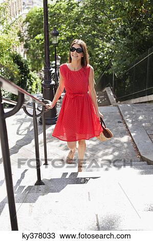 Woman moving up staircases, Montmartre, Paris, Ile-de-France, France View Large Photo Image Stock Image - Woman moving up staircases, Montmartre, Paris, Ile-de-France, France. Fotosearch