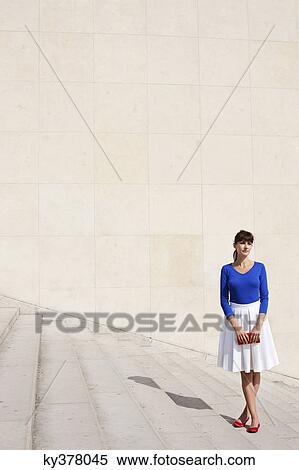 Woman standing on steps, Paris, Ile-de-France, France View Large Photo Image Stock Photography - Woman standing on steps, Paris, Ile-de-France, France. Fotosearch