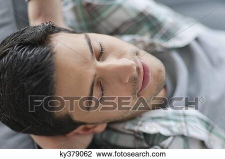Close-up of a man resting View Large Photo Image Stock Image - Close-up of a man resting. Fotosearch