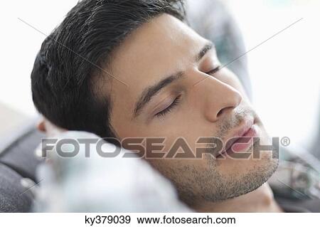 Close-up of a man sleeping View Large Photo Image Stock Photo - Close-up of a man sleeping. Fotosearch