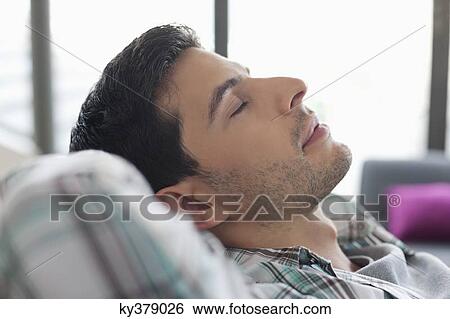 Close-up of a man sleeping View Large Photo Image Stock Photograph - Close-up of a man sleeping. Fotosearch
