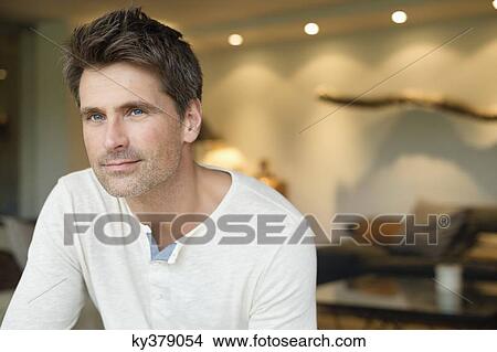 Close-up of a man thinking View Large Photo Image Picture - Close-up of a man thinking. Fotosearch