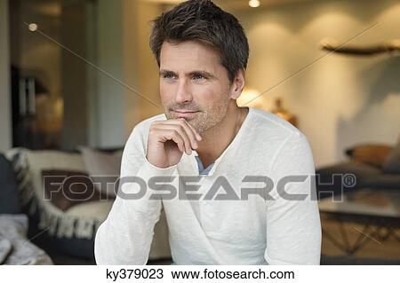 Close-up of a man thinking View Large Photo Image Stock Image - Close-up of a man thinking. Fotosearch