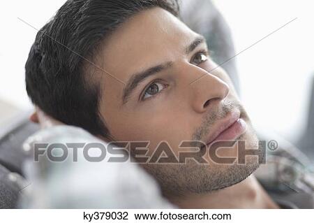 Close-up of a man thinking View Large Photo Image Stock Image - Close-up of a man thinking. Fotosearch