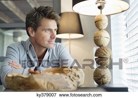 Stock Photo - Close-up of a man thinking. Fotosearch