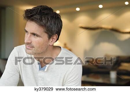 Close-up of a man thinking View Large Photo Image Stock Photo - Close-up of a man thinking. Fotosearch