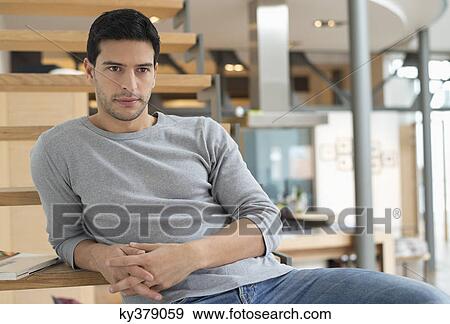 Man leaning on stairs View Large Photo Image Stock Photo - Man leaning on stairs. Fotosearch