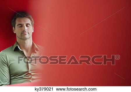 Man sitting with eyes closed View Large Photo Image Stock Image - Man sitting with eyes closed. Fotosearch