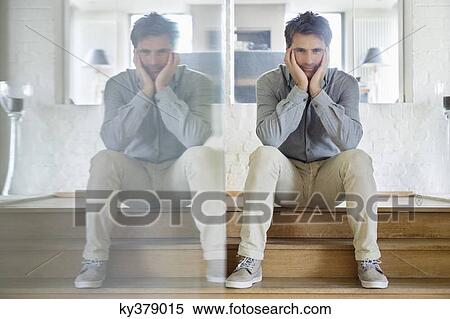 Man with his reflection on mirror looking serious View Large Photo Image Stock Photography - Man with his reflection on mirror looking serious. Fotosearch