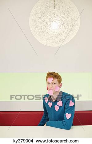 Portrait of a businessman with heart shape sticky notes on his body View Large Photo Image Picture - Portrait of a businessman with heart shape sticky notes on his body. Fotosearch