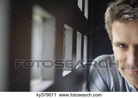 Stock Image - Portrait of a man smiling. Fotosearch