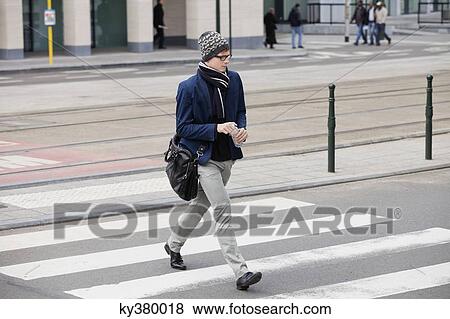 Businessman crossing the road View Large Photo Image Stock Photo - Businessman crossing the road. Fotosearch