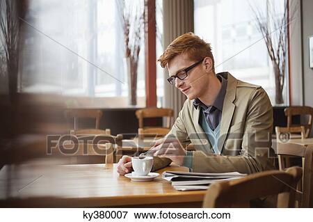 Man drinking tea in a restaurant View Large Photo Image Stock Photo - Man drinking tea in a restaurant. Fotosearch