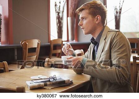 Man drinking tea in a restaurant View Large Photo Image Stock Photo - Man drinking tea in a restaurant. Fotosearch
