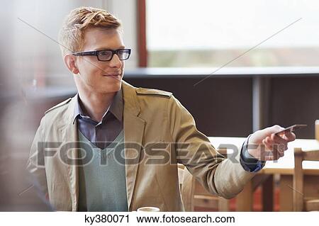 Man paying bill by credit card in a restaurant View Large Photo Image Stock Image - Man paying bill by credit card in a restaurant. Fotosearch
