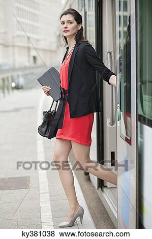 Woman exiting from a bus View Large Photo Image Stock Photo - Woman exiting from a bus. Fotosearch