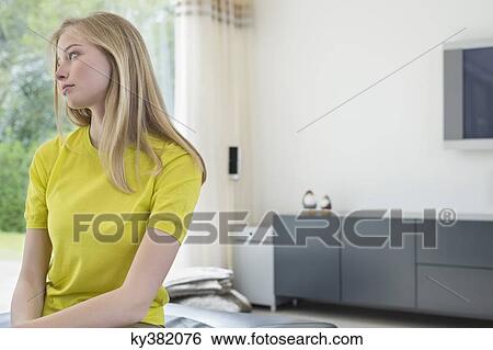Beautiful woman lost in thoughts View Large Photo Image Stock Photograph - Beautiful woman lost in thoughts. Fotosearch