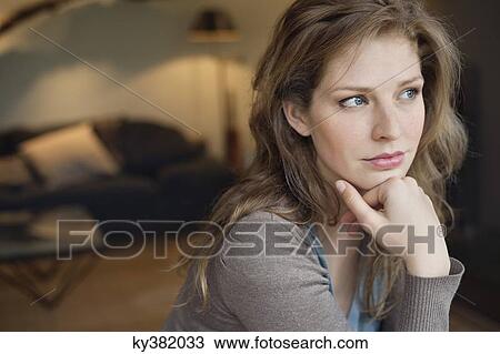 Close-up of a beautiful woman thinking View Large Photo Image Stock Image - Close-up of a beautiful woman thinking. Fotosearch