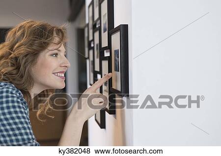 Interior designer admiring a painting View Large Photo Image Stock Photo - Interior designer admiring a painting. Fotosearch