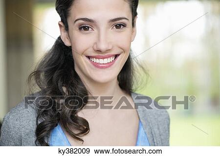Portrait of a beautiful woman smiling View Large Photo Image Stock Photo - Portrait of a beautiful woman smiling. Fotosearch
