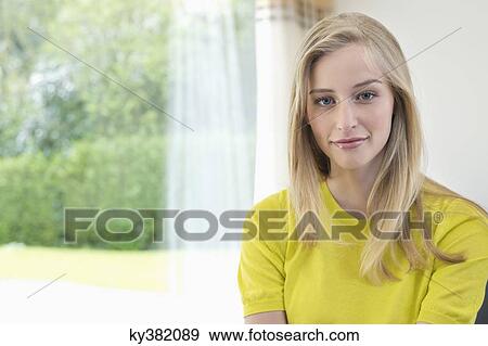 Portrait of a beautiful woman smirking View Large Photo Image Stock Photo - Portrait of a beautiful woman smirking. Fotosearch