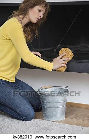 Woman cleaning fire place View Large Photo Image Stock Image - Woman cleaning fire place. Fotosearch