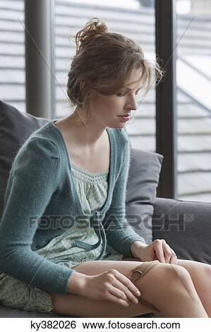 Woman putting on stockings View Large Photo Image Stock Photograph - Woman putting on stockings. Fotosearch