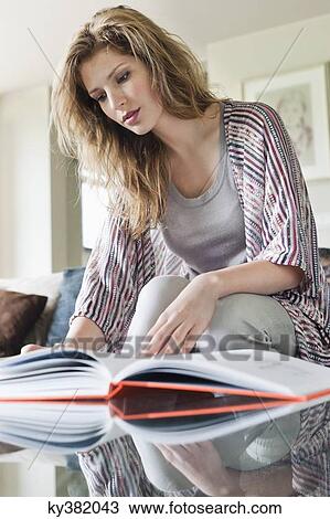 Woman reading a book View Large Photo Image Stock Image - Woman reading a book. Fotosearch