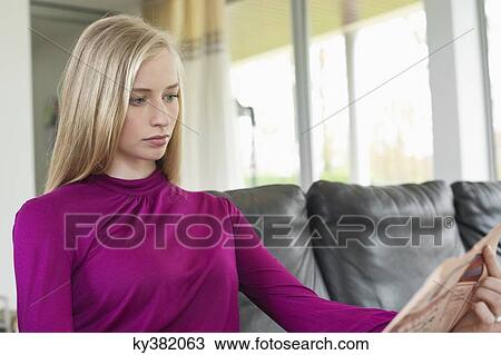 Woman reading a newspaper View Large Photo Image Stock Image - Woman reading a newspaper. Fotosearch