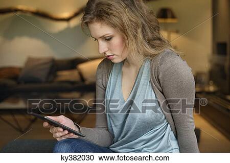 Woman using digital tablet View Large Photo Image Stock Image - Woman using digital tablet. Fotosearch