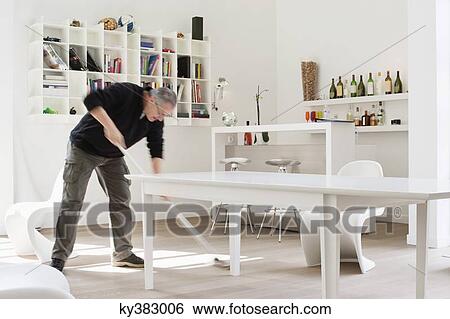 Stock Photograph - Man mopping the floor. Fotosearch