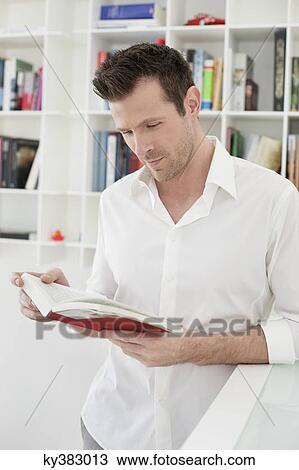 Man reading a book View Large Photo Image Stock Image - Man reading a book. Fotosearch