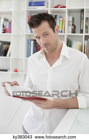Portrait of a man reading a book View Large Photo Image Stock Image - Portrait of a man reading a book. Fotosearch